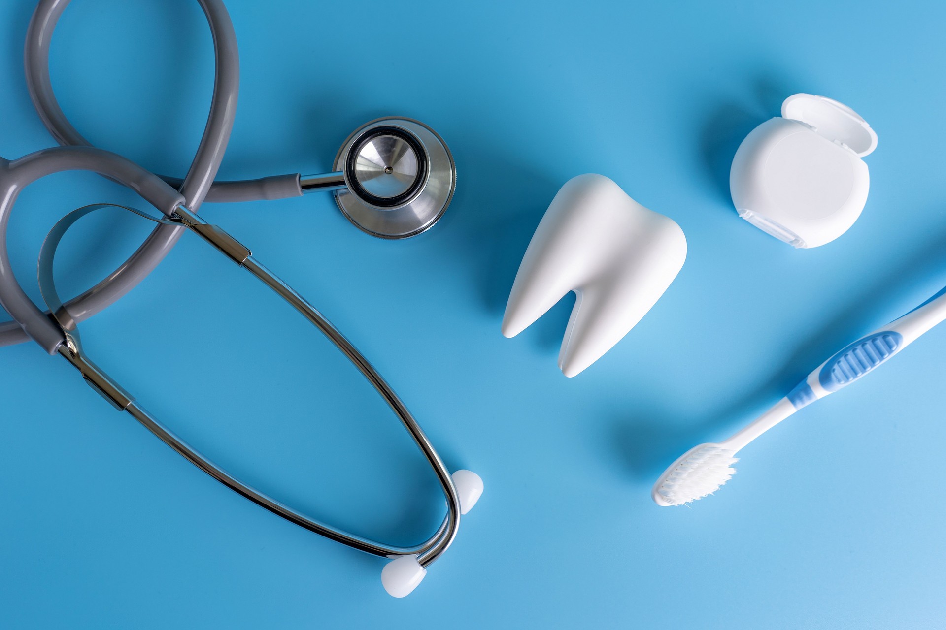 Close-Up Of Dental Equipment Over Blue Background